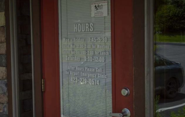 The front door with the office hours on it